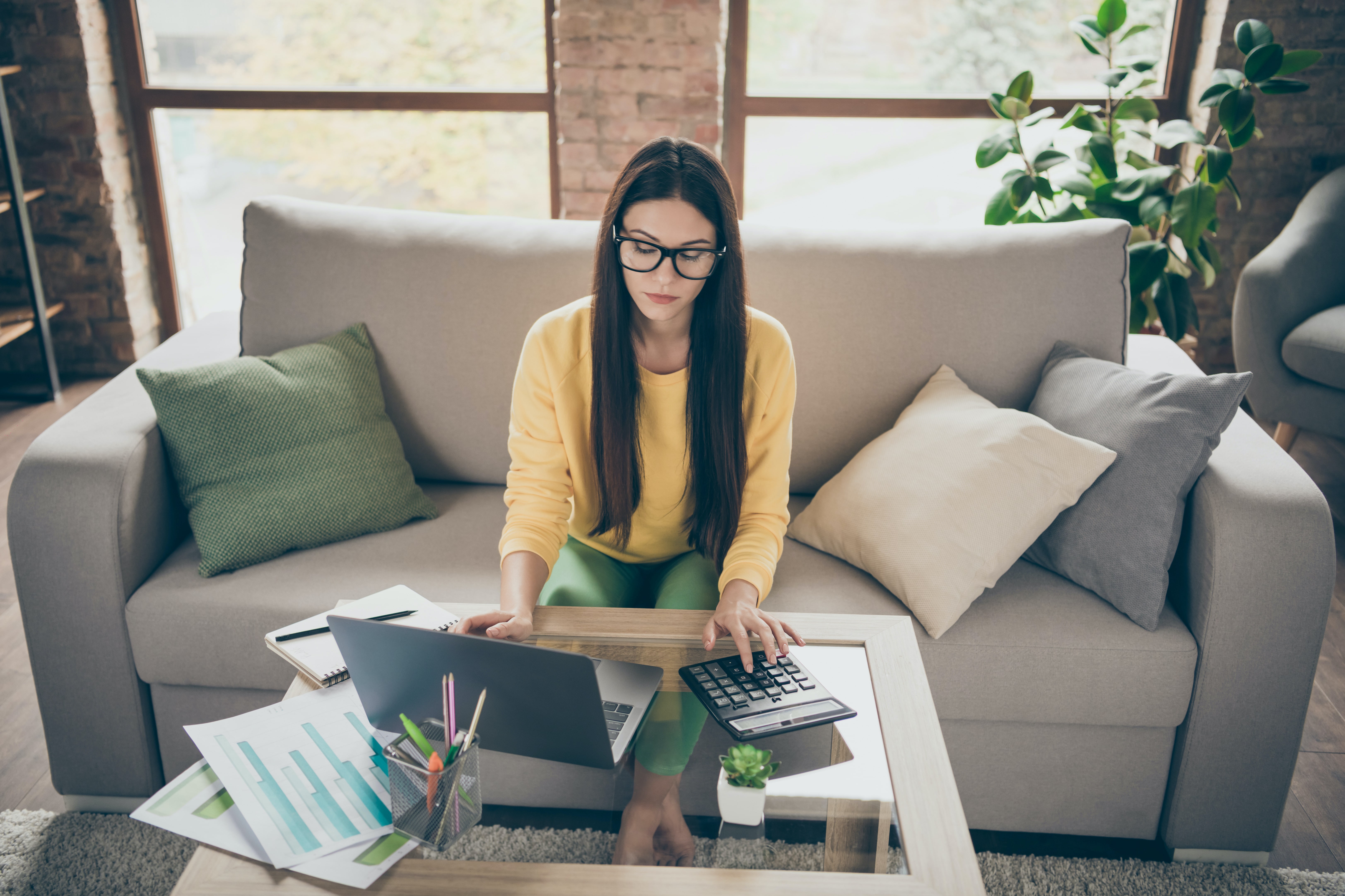 Female college student learning how to budget on low income